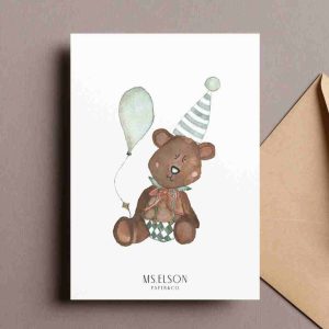 A classic teddy bear with a balloon